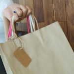 person holding shopping bag