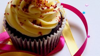 chocolate cupcake with white and red toppings